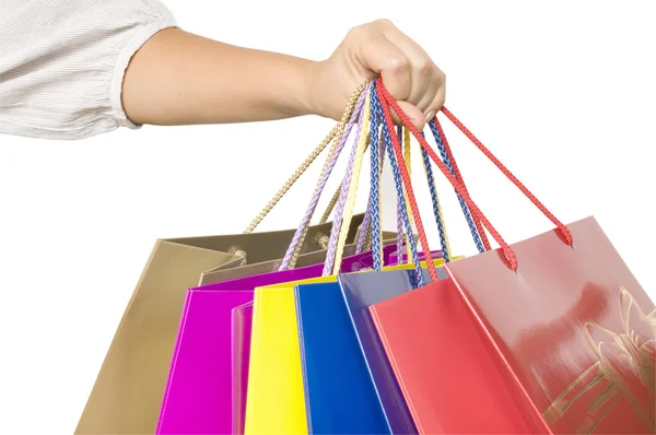 Chica mantener bolsas de compras en la mano — Foto de Stock