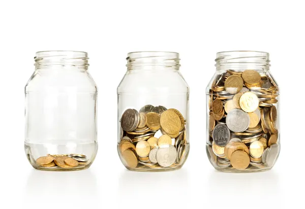 Glas banker för tips med pengar som diagram — Stockfoto