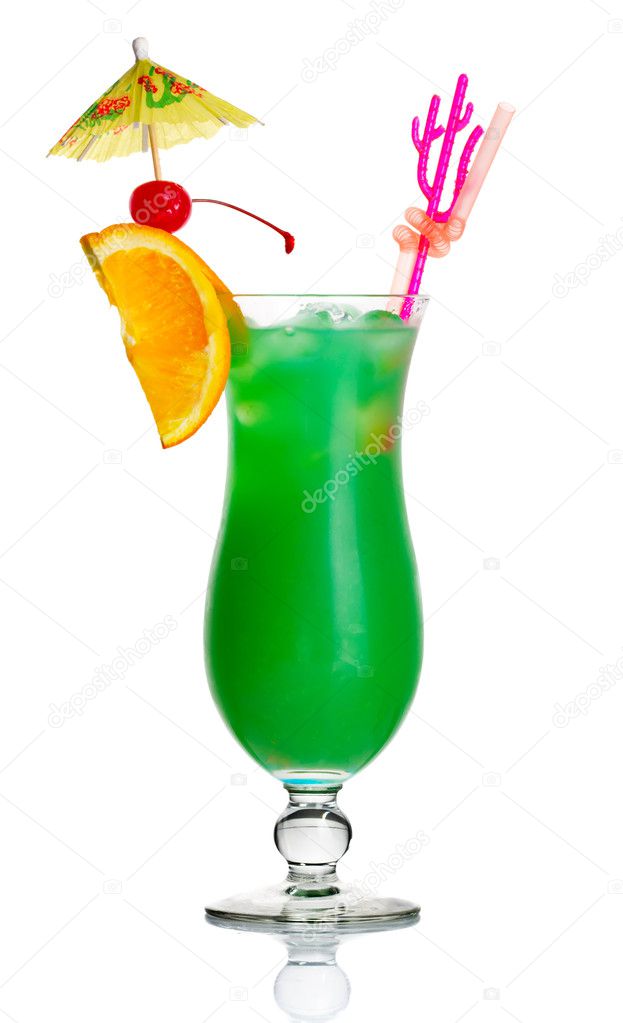 Green alcohol cocktail with orange slice and umbrella isolated