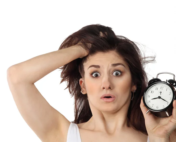 Surprised woman holding clock — Stock Photo, Image