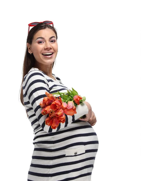 Mujer embarazada feliz con tulipanes —  Fotos de Stock