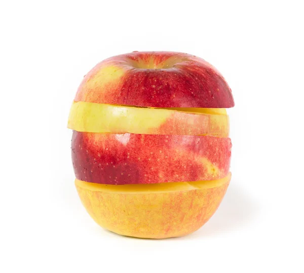 Vermelho com maçã amarela no branco — Fotografia de Stock