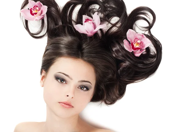 Girl with floral arrangement on her hair — Stock Photo, Image