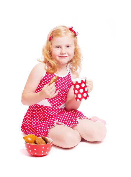 Little girl with milk and cake isolated on white — Stock Photo, Image