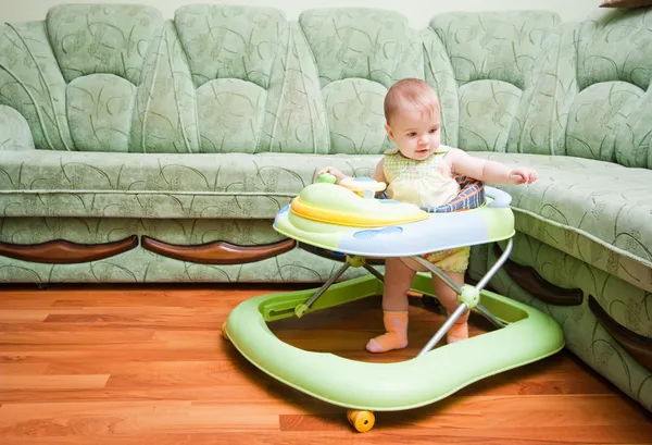 Baby in the baby walker — Stock Photo, Image