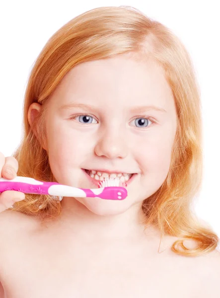 Niña pensando mientras se lava los dientes —  Fotos de Stock
