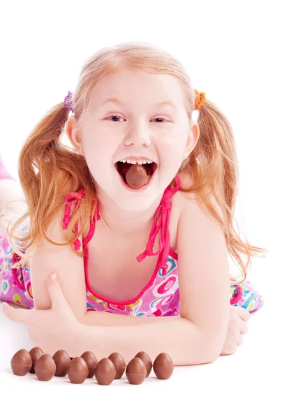 Happy girl with chocolate eggs — Stock Photo, Image