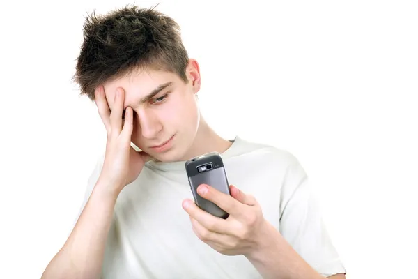 Triest tiener met telefoon — Stockfoto