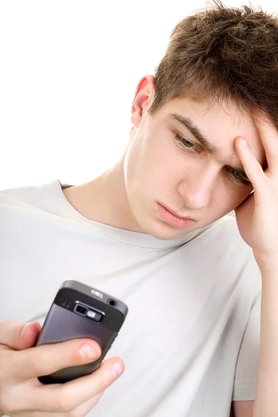 Smutný teenager s telefonem — Stock fotografie