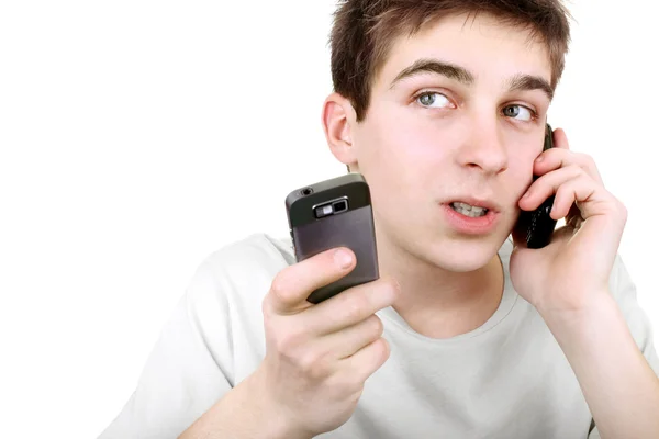 忙碌的少年与两个手机 — 图库照片