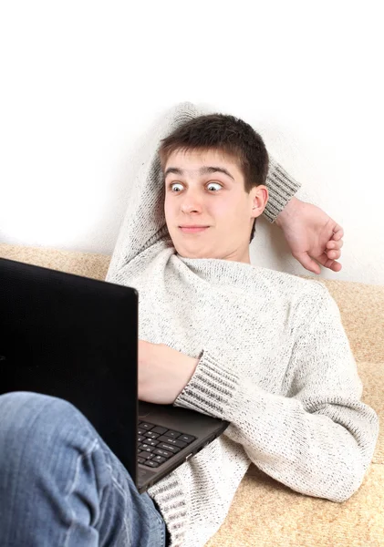 Surprised teenager with notebook — Stock Photo, Image