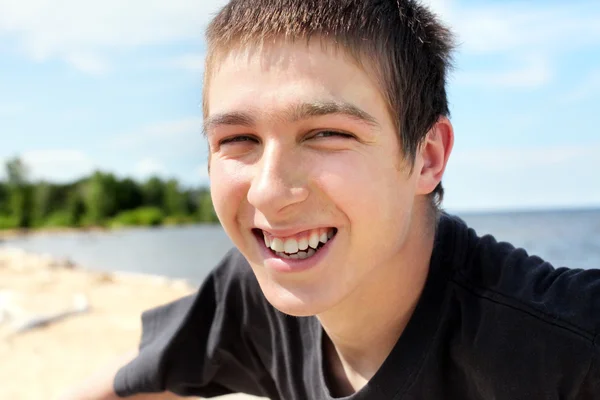 Happy young man at seaside — Stock Photo, Image