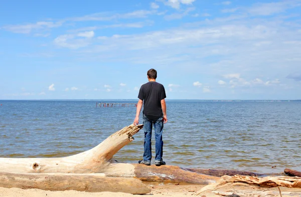 Young man near the sea — Stock Photo, Image