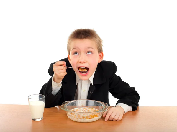 Schoolboy eats — Stock Photo, Image