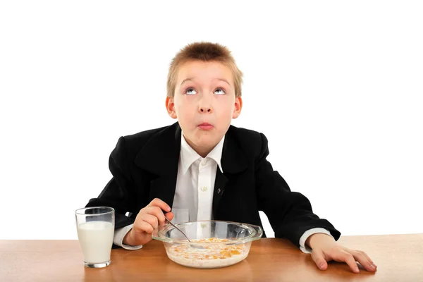 Schoolboy eats — Stock Photo, Image