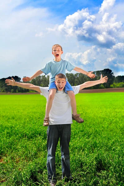 Young man and boy — Stock Photo, Image