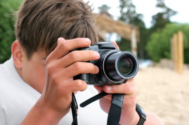 Teenager with camera clipart