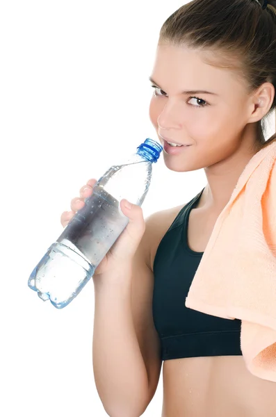 Спортивна дівчина з рушником і пляшкою з водою — стокове фото