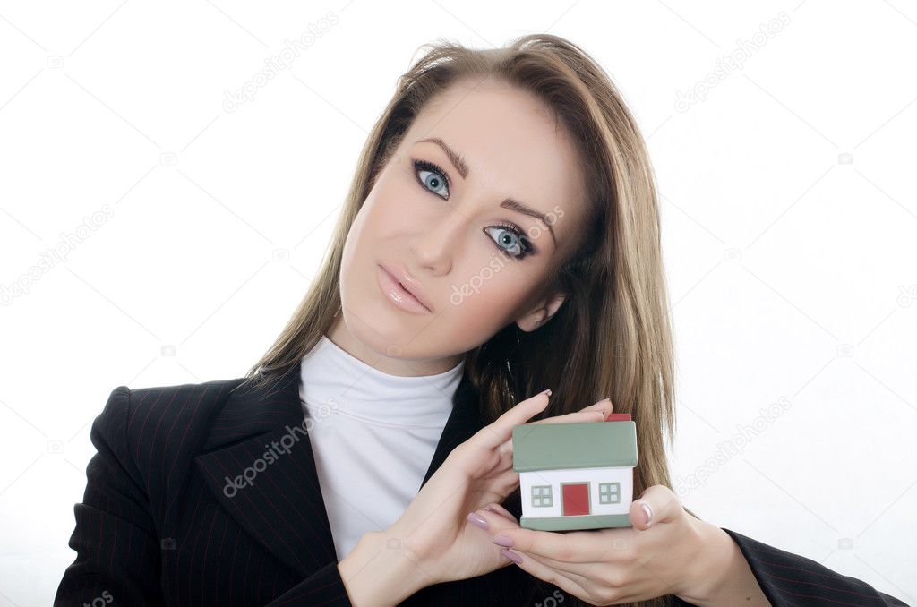 The business woman with small model of the house