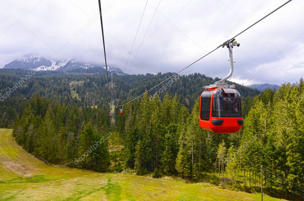 Funicular. landscape with a red cable car