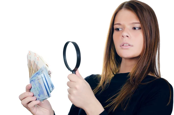 Mulher com lupa e dinheiro em euros — Fotografia de Stock