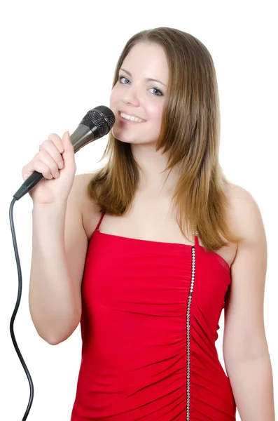 Chica con un micrófono aislado en blanco —  Fotos de Stock