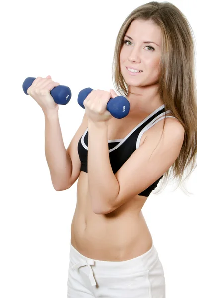 The girl does exercises with dumbbells — Stock Photo, Image