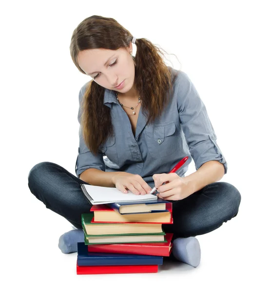 A menina bonita com livros isolados em branco — Fotografia de Stock