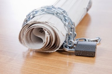 Newspapers with chains clipart