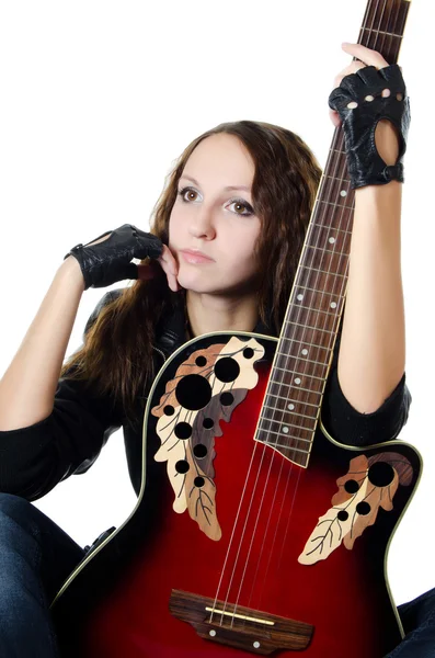 The beautiful girl in a leather jacket with a guitar — Stock Photo, Image