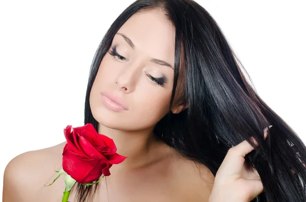 与一朵红玫瑰的美丽头发的女孩 — 图库照片