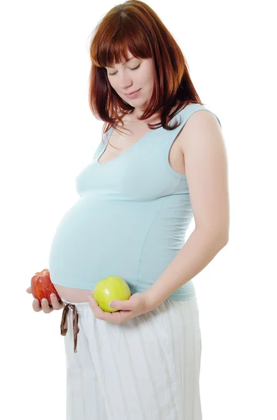 The pregnant woman with an apple — Stock Photo, Image