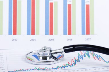 Stethoscope on a stock chart - market analysis clipart