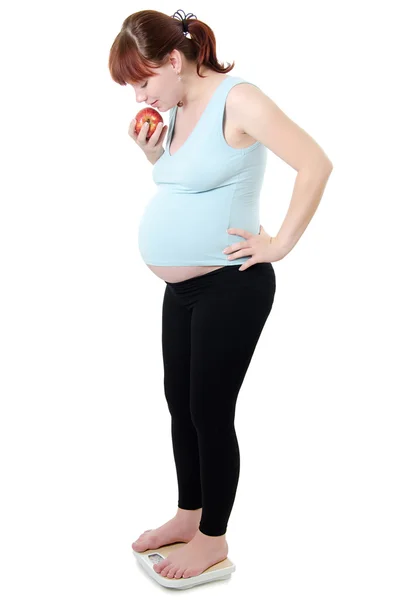 Pregnant woman with a measuring tape — Stock Photo, Image