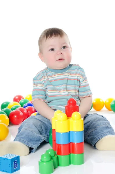 Il bambino gioca giocattoli multicolori — Foto Stock