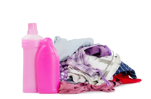 Högen av rena kläder med olika tvättmedel — Stockfoto