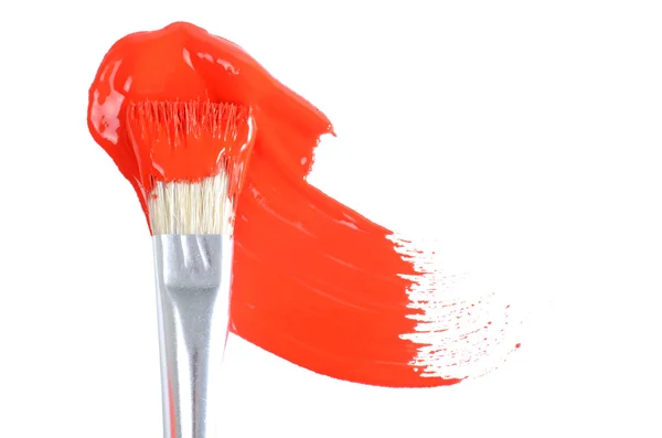 Brush with a red paint — Stockfoto