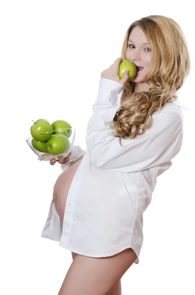 Беременная женщина с яблоками — стоковое фото