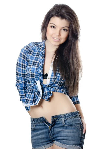 Den vackra flickan i jeansshorts — Stockfoto