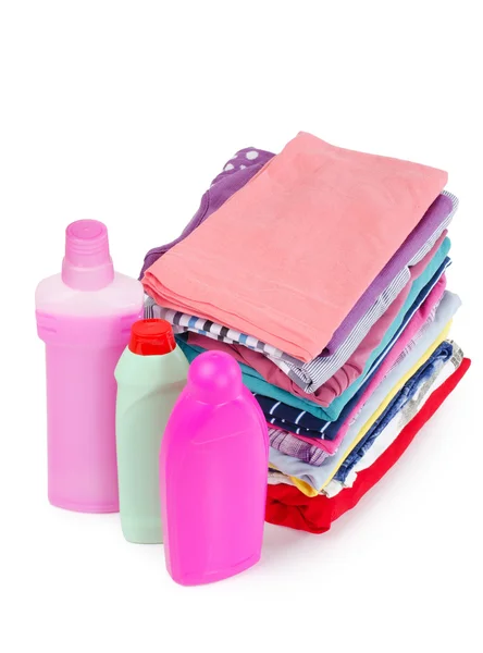 Heap of pure clothes with different detergent — Stock Photo, Image