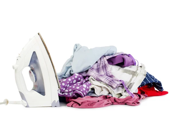 Heap of pure clothes with iron — Stock Photo, Image