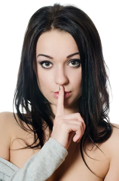 Young girl with her finger over her mouth — Stock Photo, Image