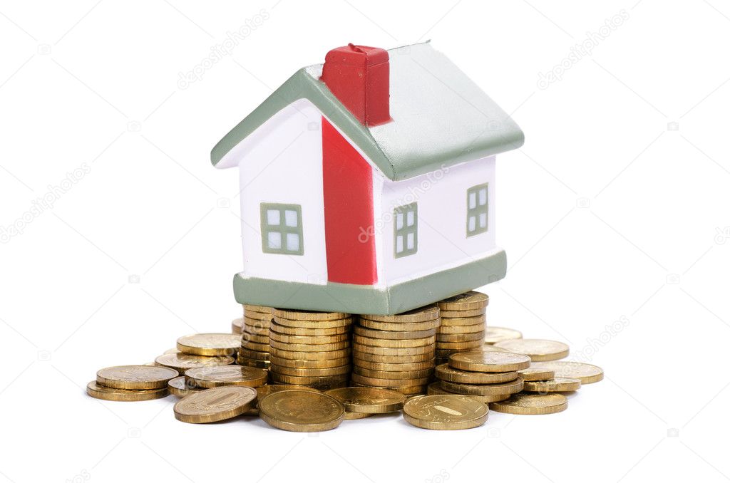 Toy small house and coins