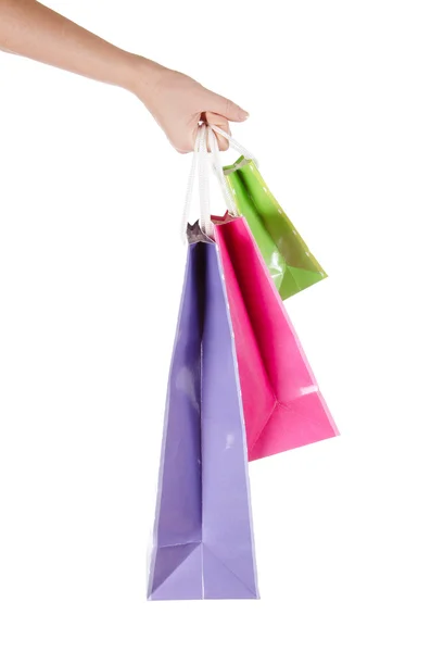 Světlé dárkové tašky v ruce izolovaných na bílém — Stock fotografie