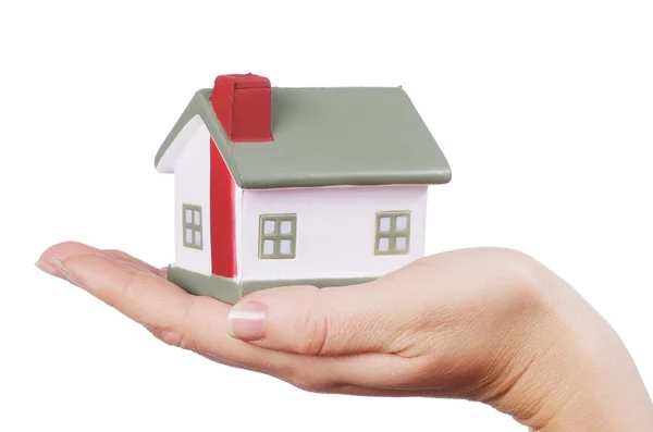 Model domu v ženských rukou na bílém pozadí Stock Fotografie