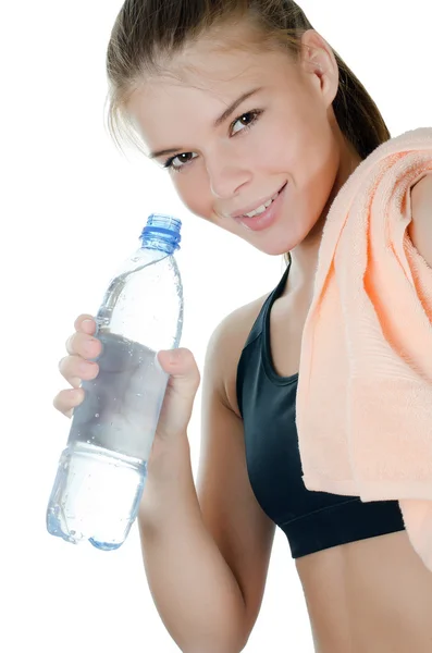 The sports girl with a towel and a water bottle — Stock Photo, Image