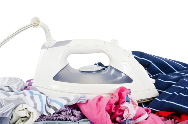 Heap of pure clothes with iron — Stock Photo, Image