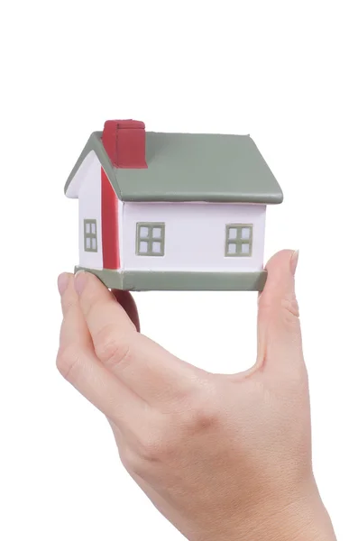 The model house in female hands on white — Stock Photo, Image