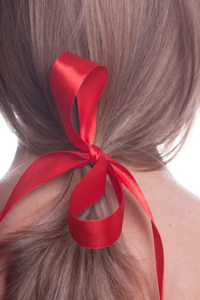 Red bow in a hair — Stock Photo, Image