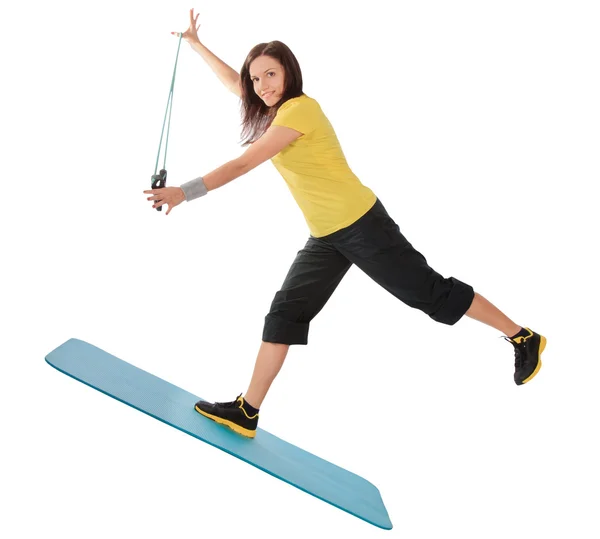 Attraktive junge Frau mit Fitness-Expander im Stretching — Stockfoto